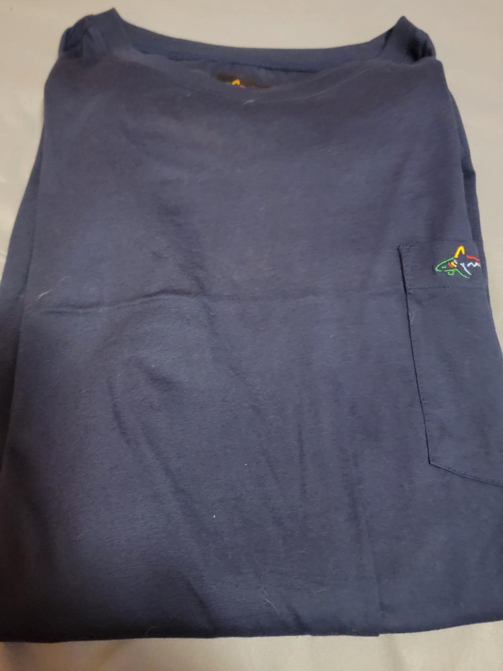Greg Norman Collection Navy Short Sleeve Pocket Tee with Multicolor Shark Logo